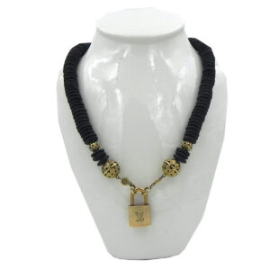 Smooth black stone and intricately crafted brass luxlock necklace