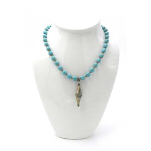 Turquoise dyed Howlite with a Brass Amulet Pendant